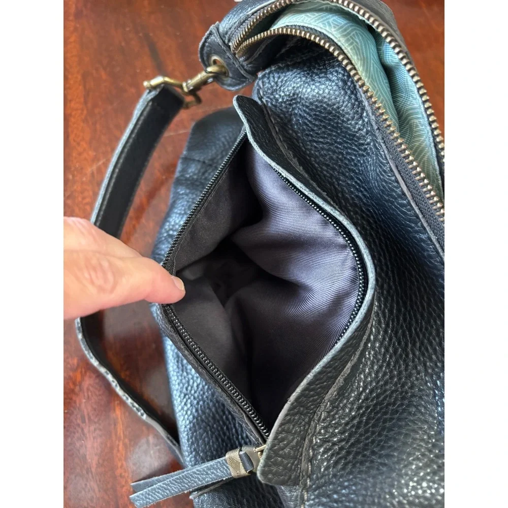 The Sak Alameda Hobo Bag Medium Black Pebbled Leather Feather Fringe Charm